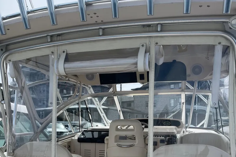 Slide: The Image of 2009 Grady-White Express 330 boat interior with helm and seating area. - 8