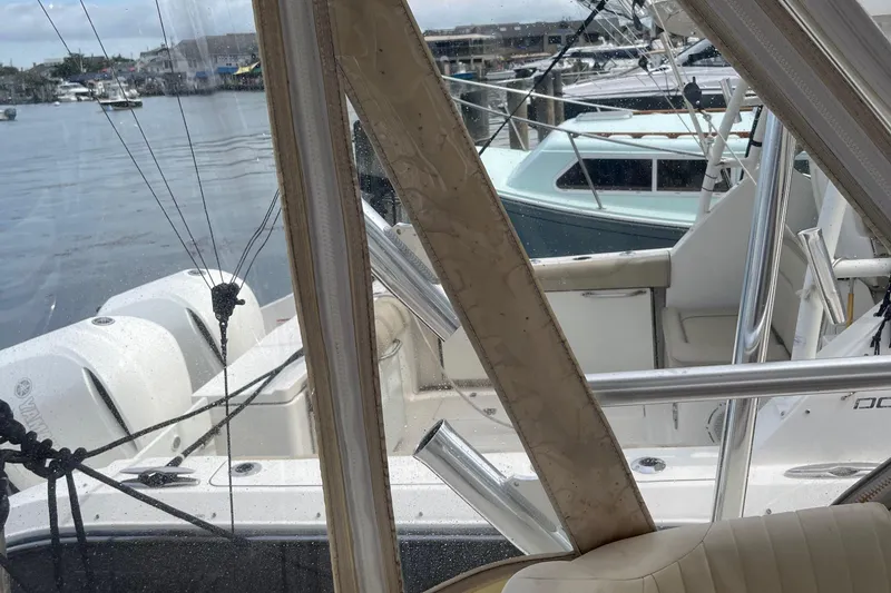 Slide: The Image of 2009 Grady-White Express 330 boat docked, view from cabin, marina in background. - 9