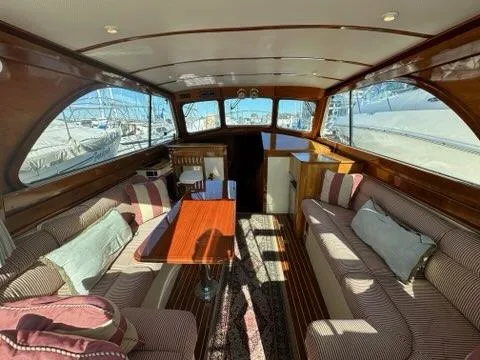 Slide: The Image of Luxurious interior of 2003 Hinckley Talaria 44 FB yacht with elegant wood finish. - 2