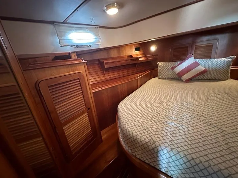 Slide: The Image of Luxurious cabin interior of 2003 Hinckley Talaria 44 FB yacht with wooden finishes. - 27