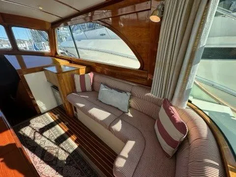 Slide: The Image of Interior of 2003 Hinckley Talaria 44 FB yacht with elegant seating and wood finish. - 3