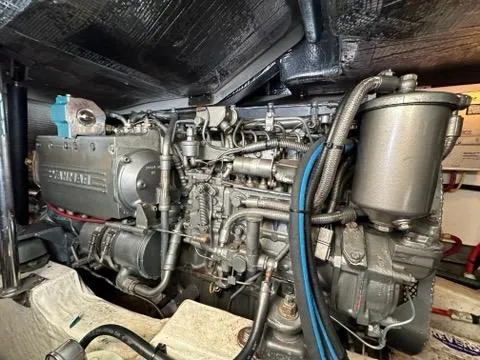 Slide: The Image of Engine of a 2003 Hinckley Talaria 44 FB yacht, showcasing intricate mechanical components. - 33