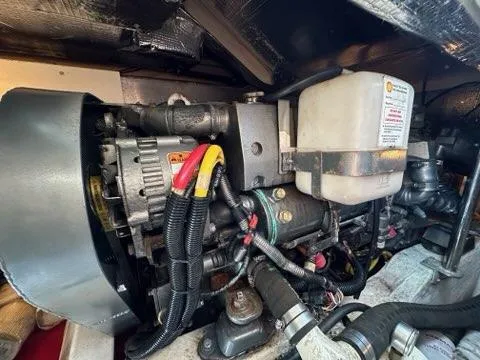 Slide: The Image of Engine compartment of a 2003 Hinckley Talaria 44 FB boat, showcasing mechanical components. - 34