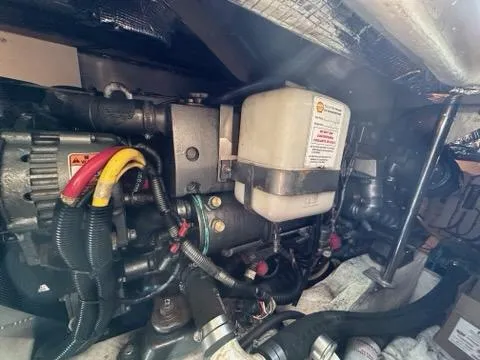 Slide: The Image of Engine compartment of a 2003 Hinckley Talaria 44 FB boat, showcasing mechanical components. - 35