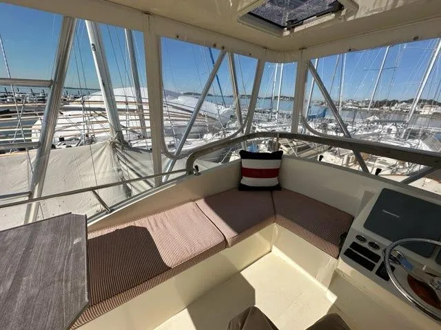 Slide: The Image of Interior view of 2003 Hinckley Talaria 44 FB yacht with seating and helm. - 39