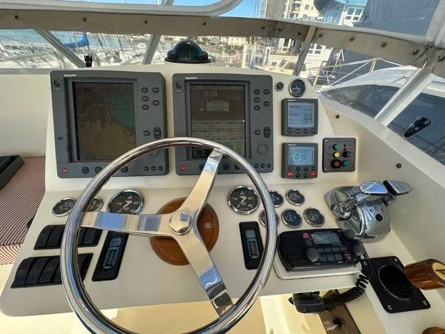 Slide: The Image of Helm of 2003 Hinckley Talaria 44 FB with navigation instruments and steering wheel. - 43