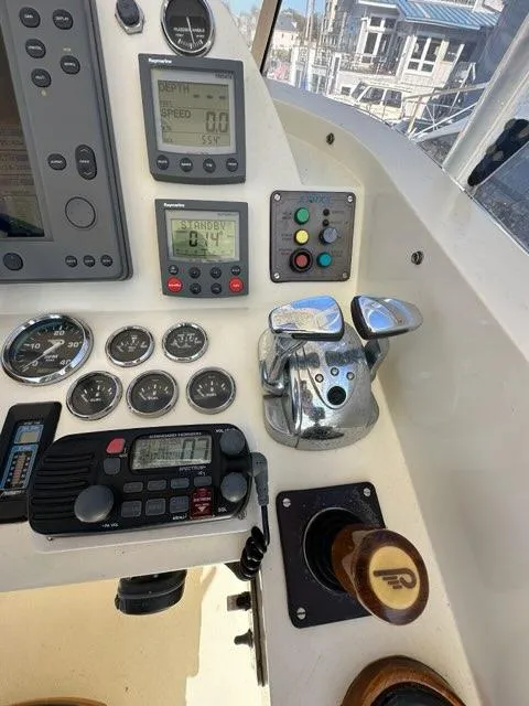 Slide: The Image of Control panel of a 2003 Hinckley Talaria 44 FB yacht with navigation instruments. - 44