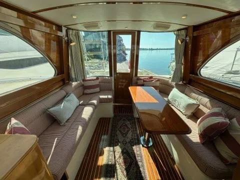 Slide: The Image of Luxurious interior of 2003 Hinckley Talaria 44 FB yacht with elegant seating and scenic views. - 8