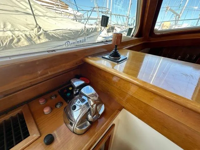 Slide: The Image of 2003 Hinckley Talaria 44 FB yacht helm with controls and joystick. - 9