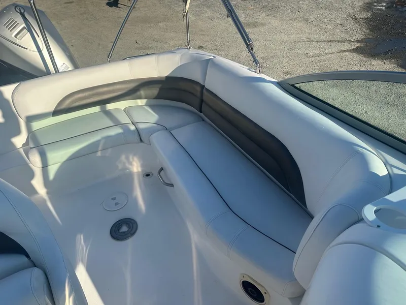 Slide: The Image of 2012 Godfrey Hurricane 237 boat interior with white and gray seating. - 11