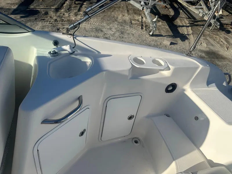 Slide: The Image of 2012 Godfrey Hurricane 237 boat interior with sink and storage compartments. - 13