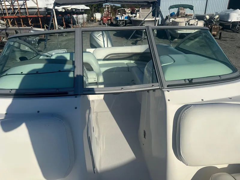 Slide: The Image of 2012 Godfrey Hurricane 237 boat with white interior and dual windshields. - 6