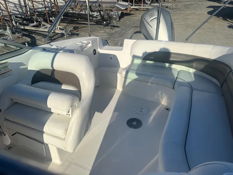 Slide: The Image of 2012 Godfrey Hurricane 237 boat interior with white seating and spacious layout. - 8