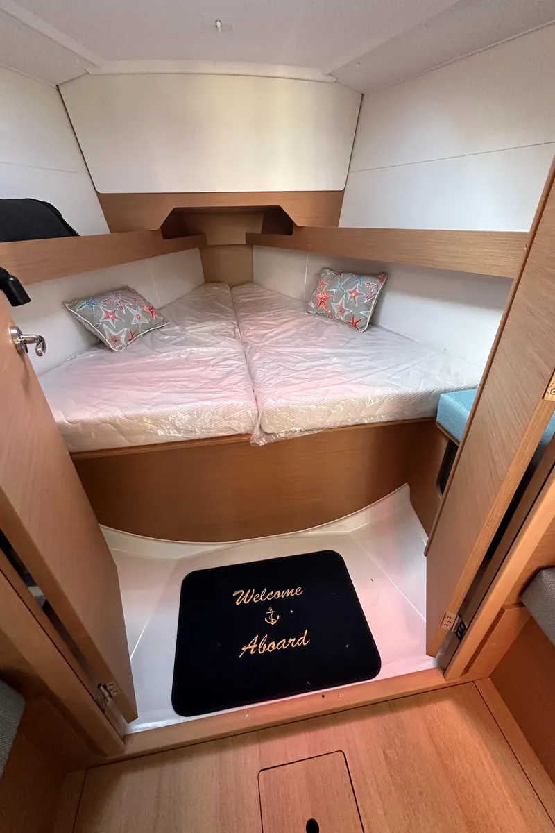 Slide: The Image of Cozy cabin interior of 2022 Jeanneau Sun Odyssey 349 sailboat with welcoming decor. - 14