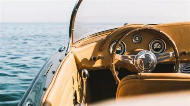 Slide: The Image of 2022 Seven Seas Yachts Speedster interior with classic steering wheel, overlooking the ocean. - 2