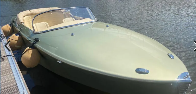 Slide: The Image of 2022 Seven Seas Yachts Speedster, sleek design, docked on calm water. - 7