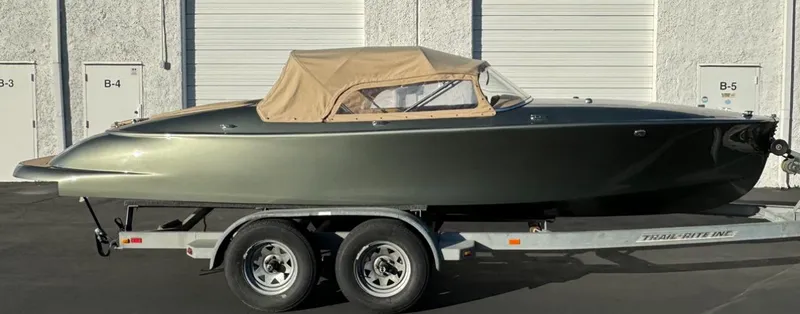 Slide: The Image of 2022 Seven Seas Yachts Speedster on trailer, sleek design with beige canopy. - 8