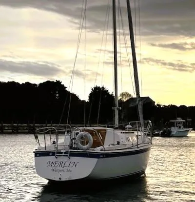 Slide: The Image of 1979 O'Day 28 sailboat "Merlin" on calm water at sunset. - 1