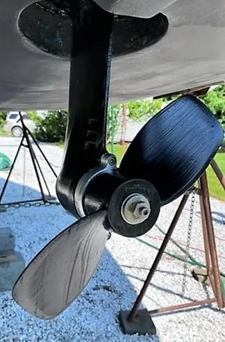 Slide: The Image of Propeller of a 1979 O'Day 28 sailboat on a gravel surface. - 11