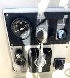 Slide: The Image of Control panel of a 1979 O'Day 28 sailboat with gauges and levers. - 28