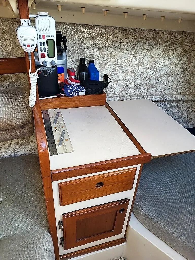 Slide: The Image of 1979 O'Day 28 sailboat interior with navigation equipment and storage. - 33