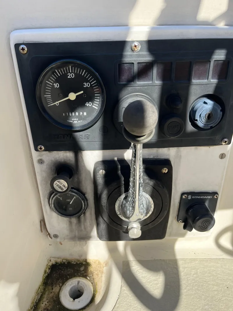 Slide: The Image of Control panel of a 1979 O'Day 28 sailboat with throttle and gauges. - 40