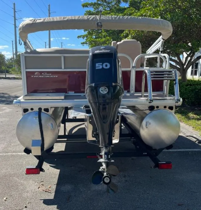 Slide: The Image of 2025 Sun Tracker Bass Buggy 16 XL Select pontoon boat with 50 HP motor, rear view. - 3
