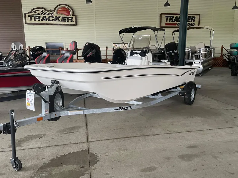 The Image of 2025 Mako Pro Skiff 17 CC boat on trailer in showroom. - 0