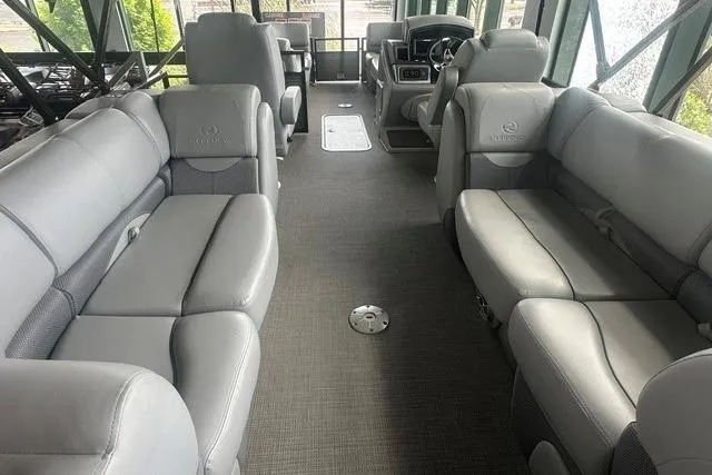 Slide: The Image of Luxurious interior of 2025 Regency 230 DL3 pontoon boat with plush gray seating. - 3