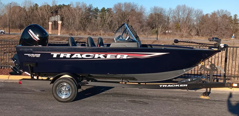 The Image of 2025 Tracker Pro Guide V-175 WT boat on trailer, parked outdoors. - 0