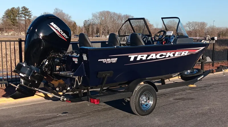 Slide: The Image of 2025 Tracker Pro Guide V-175 WT boat on trailer, parked outdoors. - 3