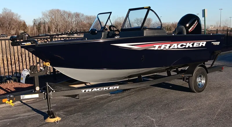 Slide: The Image of 2025 Tracker Pro Guide V-175 WT boat on trailer, parked outdoors. - 5