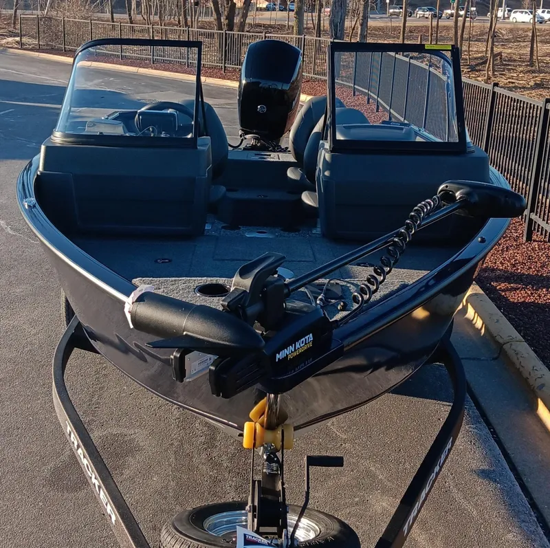Slide: The Image of 2025 Tracker Pro Guide V-175 WT boat on trailer, featuring Minn Kota trolling motor. - 7