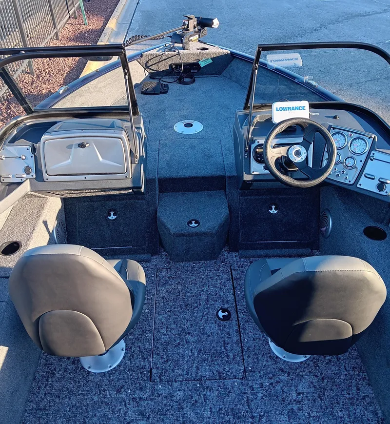 Slide: The Image of 2025 Tracker Pro Guide V-175 WT boat interior with dual seats and steering console. - 8