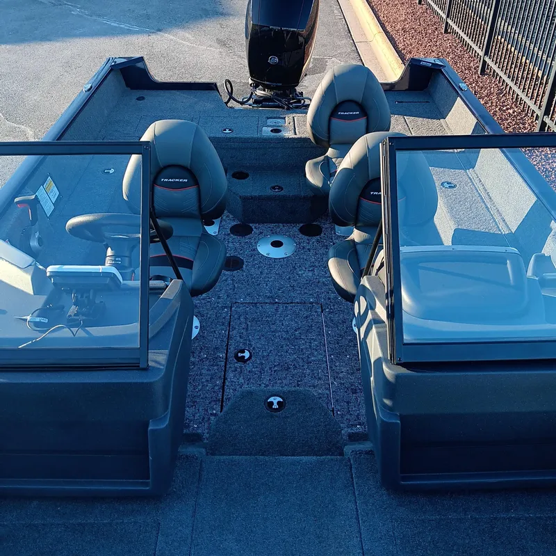 Slide: The Image of 2025 Tracker Pro Guide V-175 WT boat interior with seating and windshield. - 9