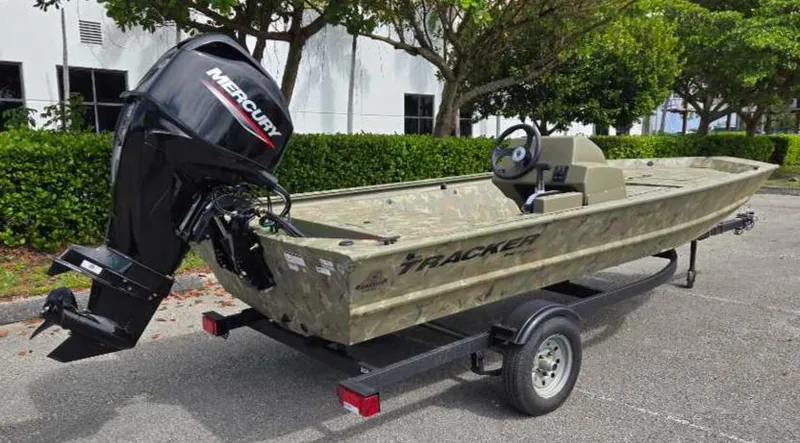 Slide: The Image of 2025 Tracker Grizzly 1648 SC boat with Mercury engine on trailer. - 4
