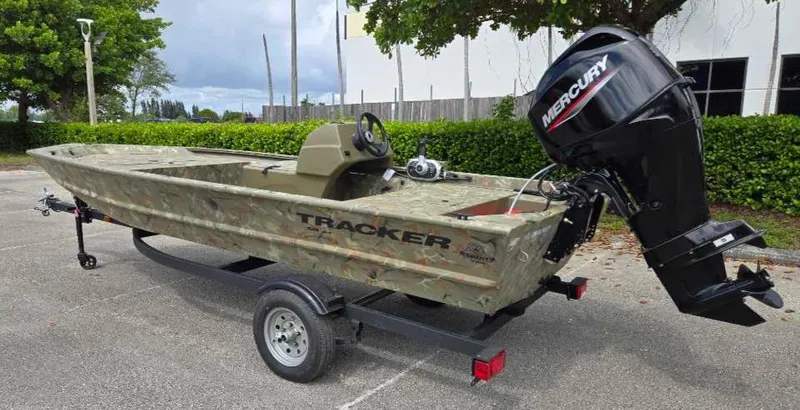 Slide: The Image of 2025 Tracker Grizzly 1648 SC boat with Mercury engine on trailer. - 8