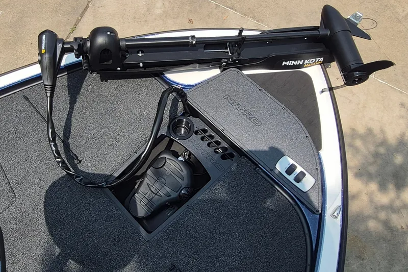Slide: The Image of 2025 Nitro Z19 boat deck with Minn Kota trolling motor and foot pedal. - 13