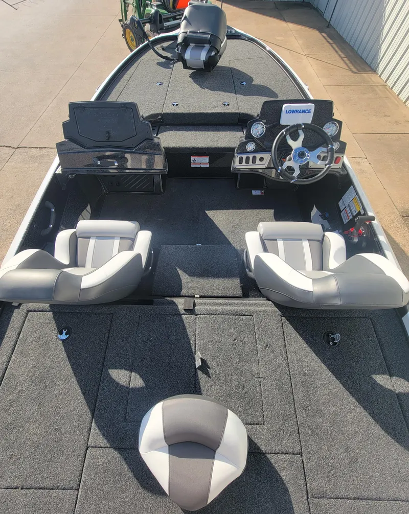 Slide: The Image of 2025 Nitro Z18 boat interior with dual seats and modern dashboard. - 2