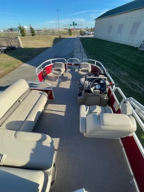 Slide: The Image of 2025 Sun Tracker Bass Buggy 16 XL Select pontoon boat with spacious seating and modern design. - 3