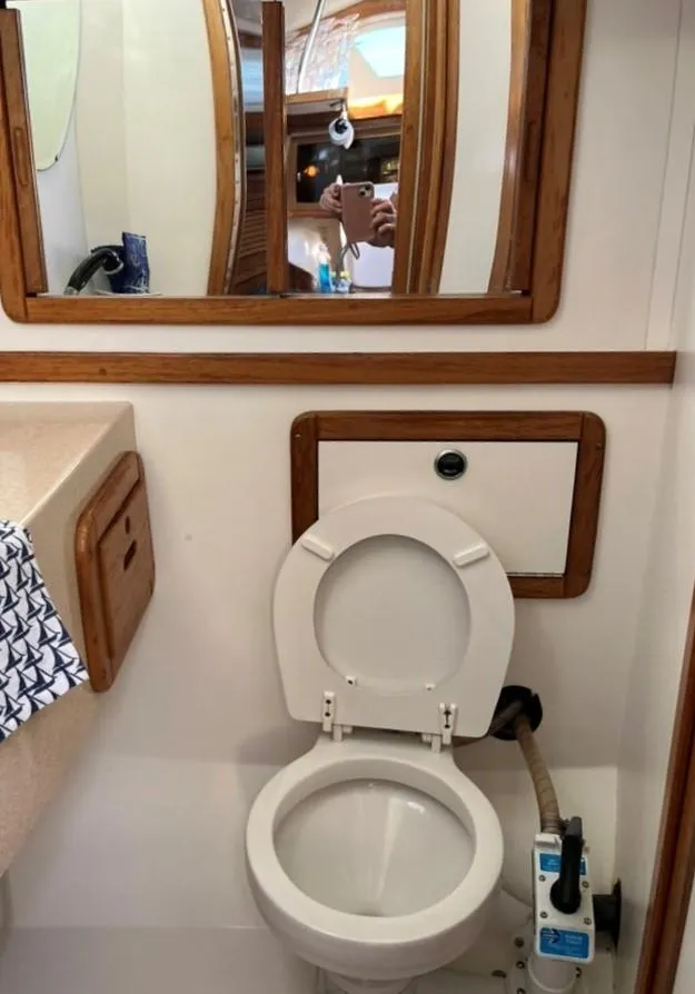 Slide: The Image of Interior of 1998 Catalina 42 Mk II sailboat with wooden cabinetry and flooring. - 22