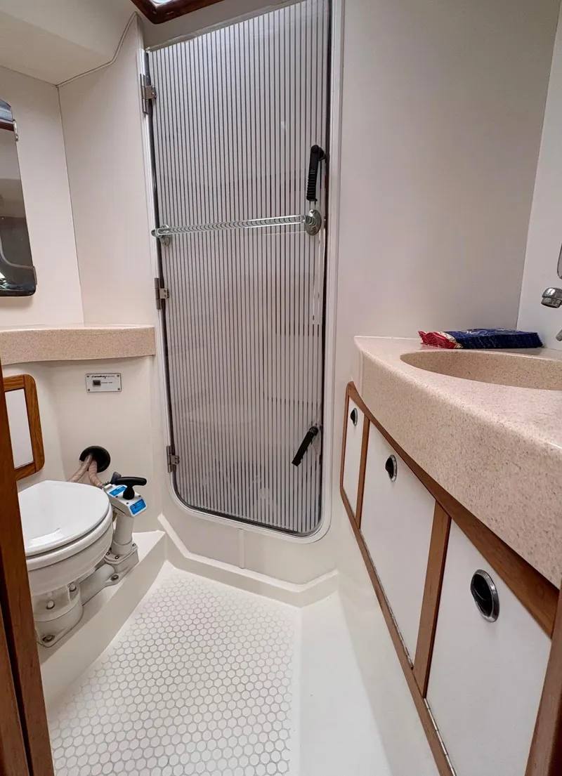 Slide: The Image of Winch on 1998 Catalina 42 Mk II sailboat with rope wrapped around it. - 29