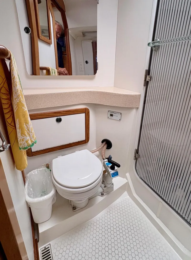 Slide: The Image of 1998 Catalina 42 Mk II yacht bathroom with shower, toilet, and sink. - 30