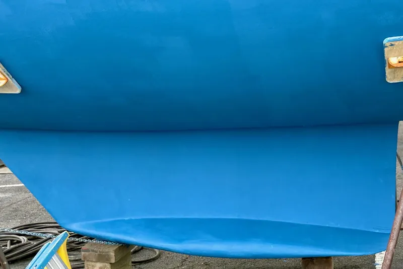 Slide: The Image of Blue keel of a 1998 Catalina 42 Mk II sailboat on a stand. - 32