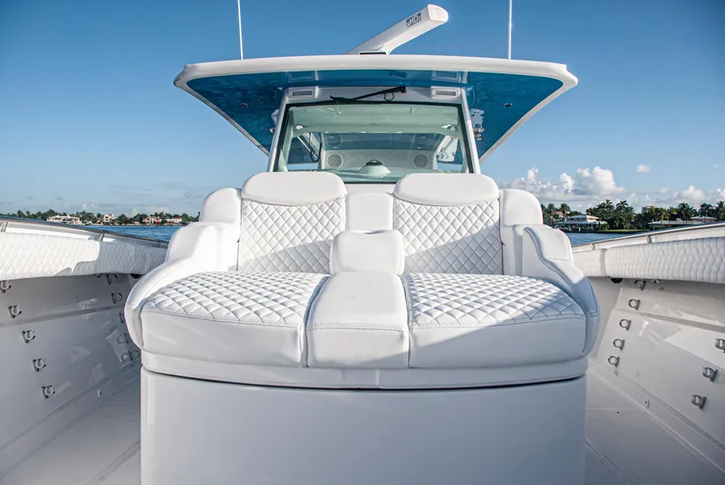 Slide: The Image of Luxurious seating on 2022 HCB 53 Sueños boat, featuring elegant white upholstery. - 17