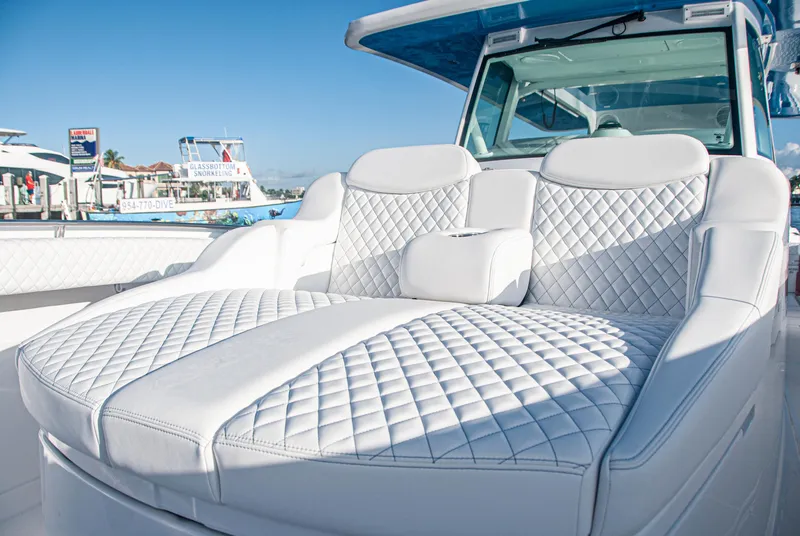 Slide: The Image of Luxurious seating on 2022 HCB 53 Sueños boat with quilted white upholstery. - 18
