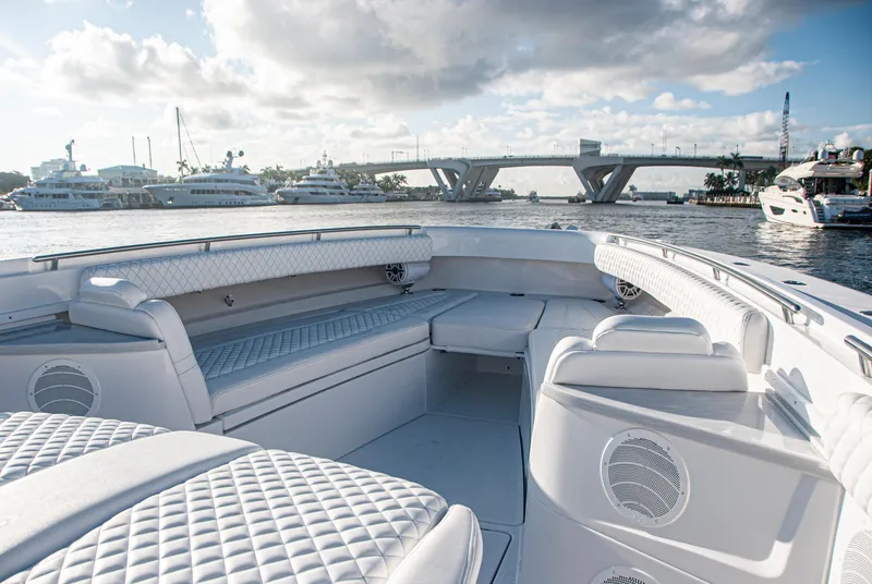 Slide: The Image of Luxurious 2022 HCB 53 Sueños boat interior with waterfront view and bridge in the background. - 20
