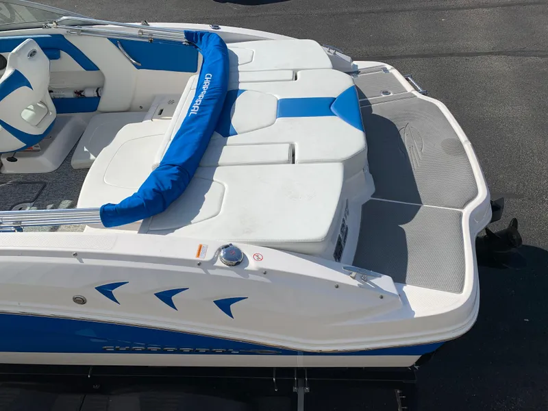 Slide: The Image of 2018 Chaparral 21 H2O Sport boat, white and blue interior, rear view. - 2