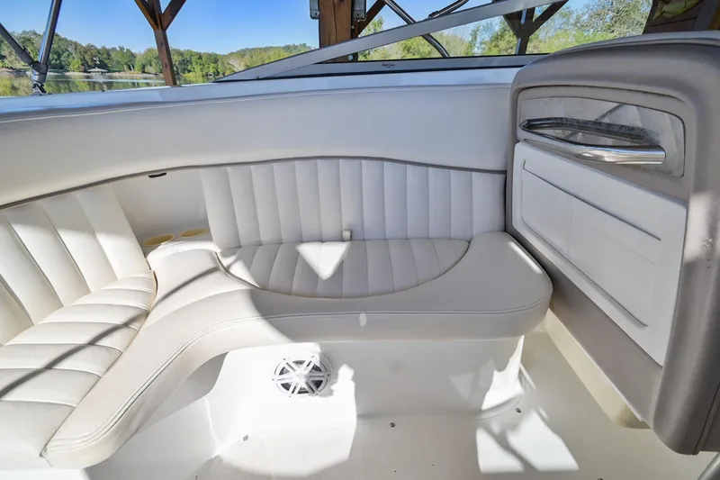 Slide: The Image of Interior of a 2002 Cobalt 262 boat with white leather seating. - 18