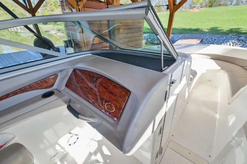 Slide: The Image of Interior view of a 2002 Cobalt 262 boat, featuring sleek design and wood accents. - 22